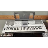 A Yamaha keyboard CDs etc