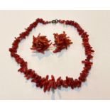 A coral necklace + a matching pair of clip earrings, necklace weight 20gms.