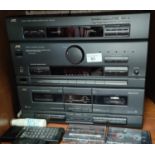 A JVC stacking record stereo deck and speakers; a 32" LG TV