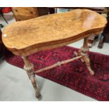 A 19th century burr walnut occasional table with inlay to the top, turning and hinged top with