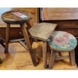 An oak round occasional table & three stools.