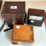 Three vintage scientific instruments, a leather cased bakelite record minor tester, an ohms tester