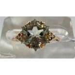 A lady's 9 carat gold dress ring set central large Wobito snowflake prasiolite, 4.11 carats, each