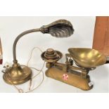 A set of brass kitchen scales and weights; a brass reading lamp