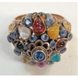 A yellow cluster ring set multicoloured stones, stamped '14k', 8.8gm