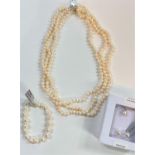 A triple necklace of naturally coloured kaori pearls, 6.5 x 5mm; a similar pearl pendant necklace