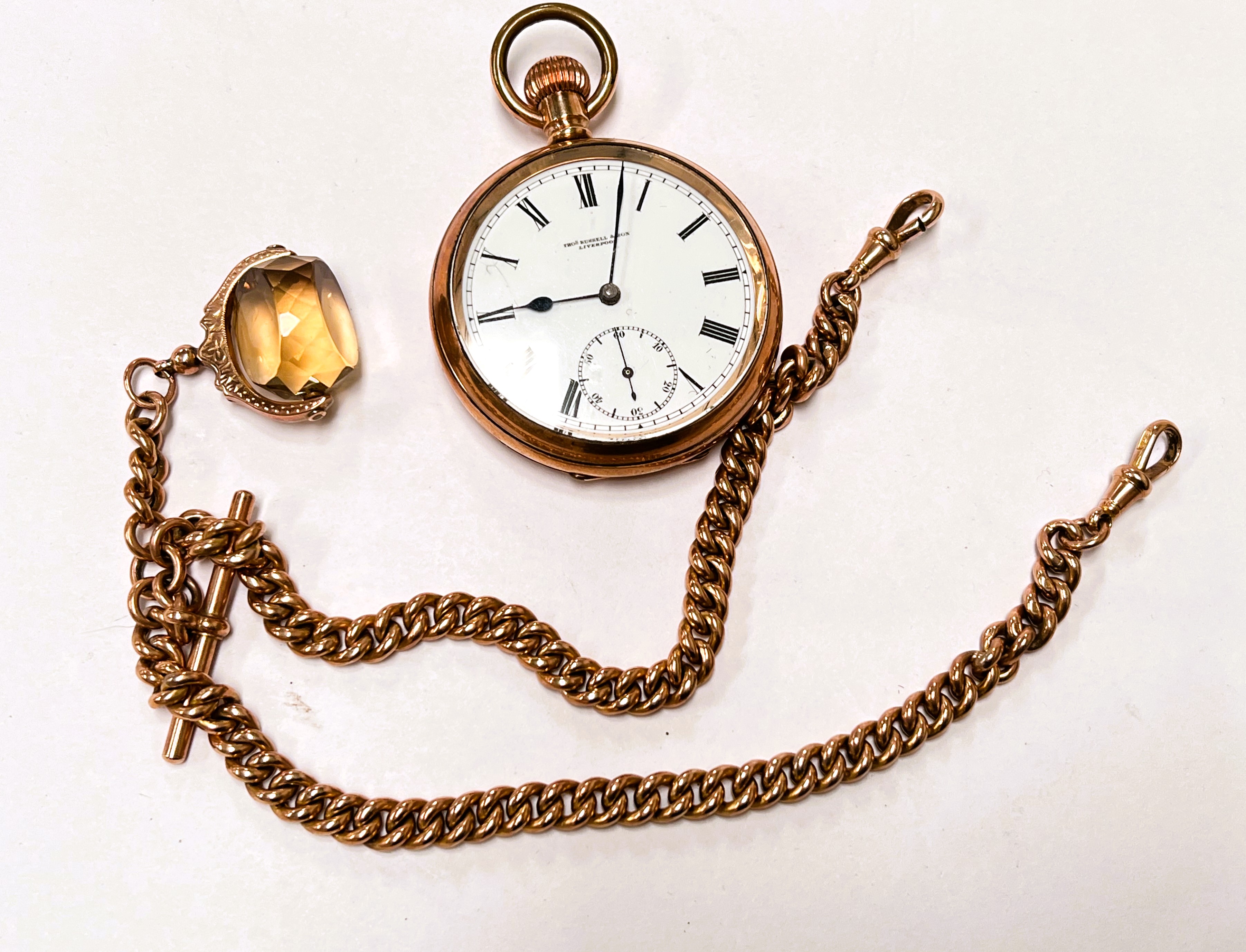 A Tomas Russell of Liverpool half hunter gilt cased pocket watch on yellow metal chain stamped 9c