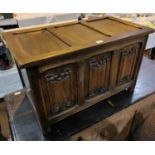 A Jacobean style blanket box in carved oak