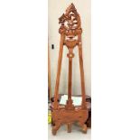 A carved wooden A framed picture stand (support missing)