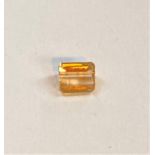 A step cut Imperial Topaz, 0.65 carat, 5.25 x 4.25mm