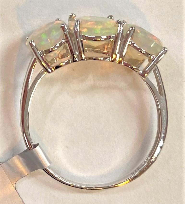 A 9 carat white gold dress ring set 3 oval Kelayi opals, total opal weight 2.73 carats, size N/O; - Image 7 of 8