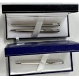 A Parker stainless steel fountain pen and ballpoint pen, in original box; a Waterman ballpoint pen