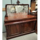 A mahogany mirror back sideboard with two arch panel doors, fitted double drawers, squared mirror (