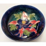 A Moorcroft blue ground large bowl Columbine pattern, dia. 23.5cm, signed WM