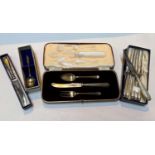 A hallmarked silver christening set, boxed, Sheffield 1932; a set of 6 silver handled tea knives,