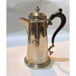 A hallmarked silver hot water jug with hinged lid, shaped handle on stepped foot, Sheffield , 13.3oz