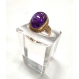 A Victorian style 9 carat hallmarked gold ring set with a large carbuncle amethyst colour stone, 4.