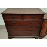 A reproduction mahogany chest of 3 long and 2 short drawers with brass swan neck handles and bracket