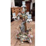 A Dresden style candelabrum with 3 scrolling arms, 4 candle cups, decorated with female figure and