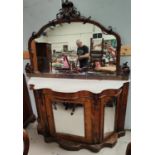 A Victorian walnut mirror door, mirror backed credenza with serpentine front, four doors, marble top