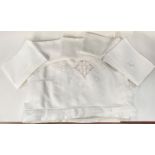 A Maltese embroidered tablecloth, 104 x 66, with 10 napkins