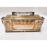 An Art Deco silver plate WMF 'Four Seasons' jewellery casket with embossed faces, length 43cm
