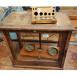 A mahogany cased scientific balance by Philip Harris and a cased set of weights