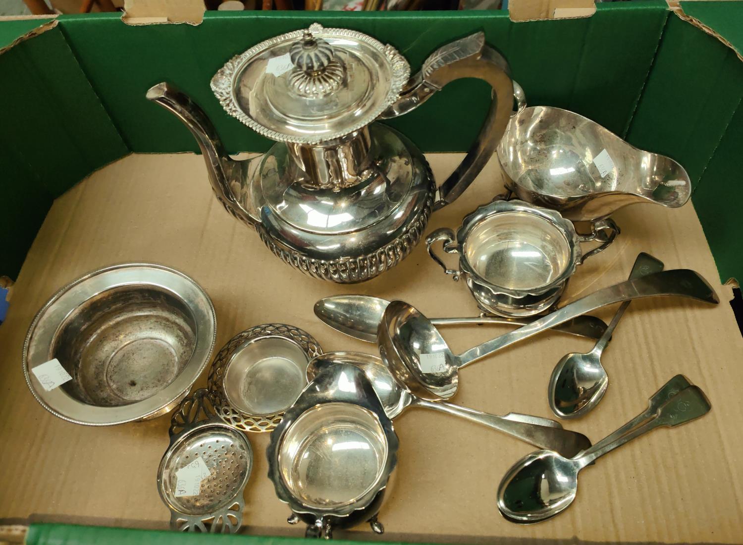 A silver plated 3 piece tea service, silver plated ladle and other silver plated spoons etc