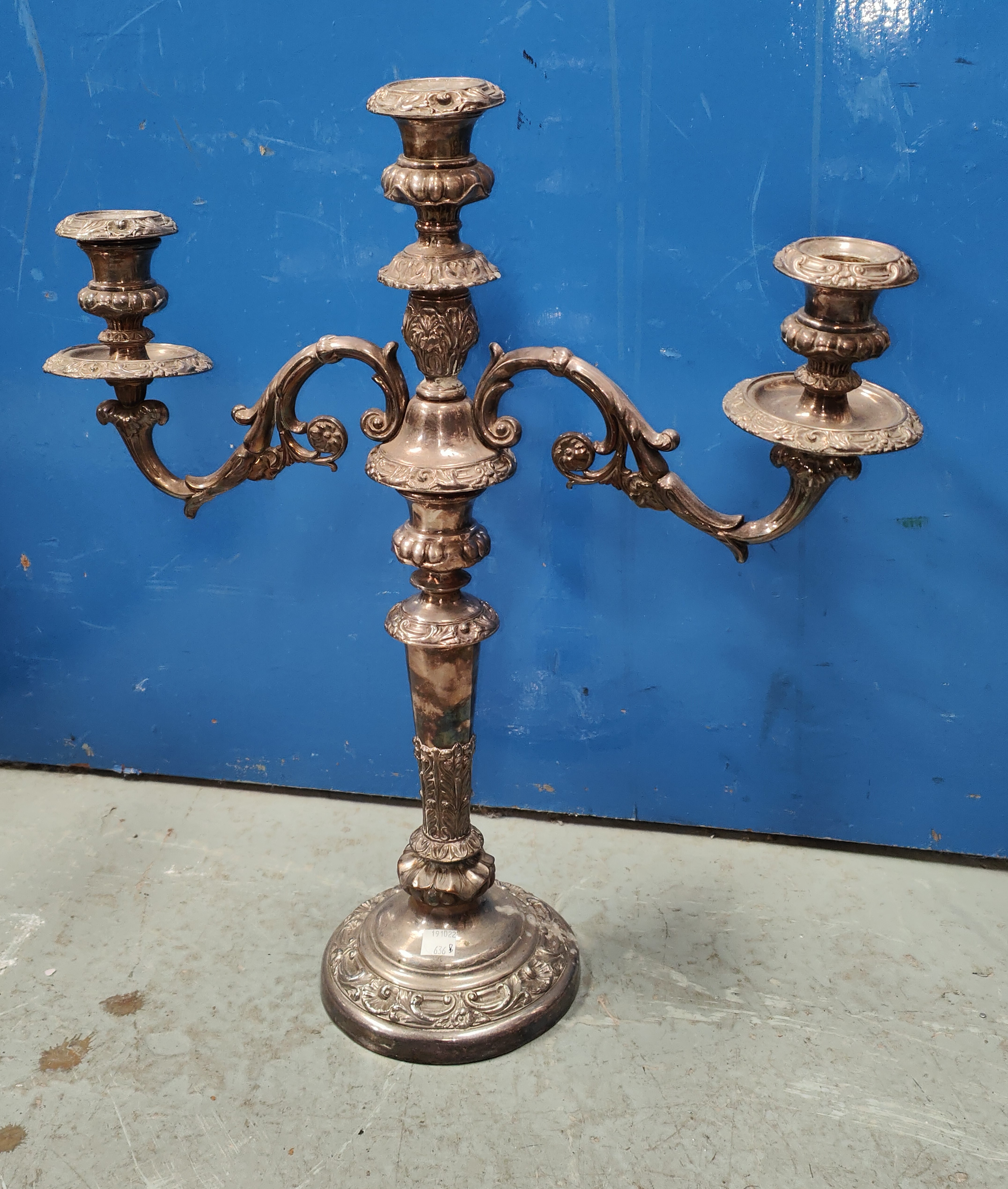 A silver plated three branch candelabra