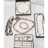 A selection of multi-coloured pearl style necklaces, bracelets and earrings