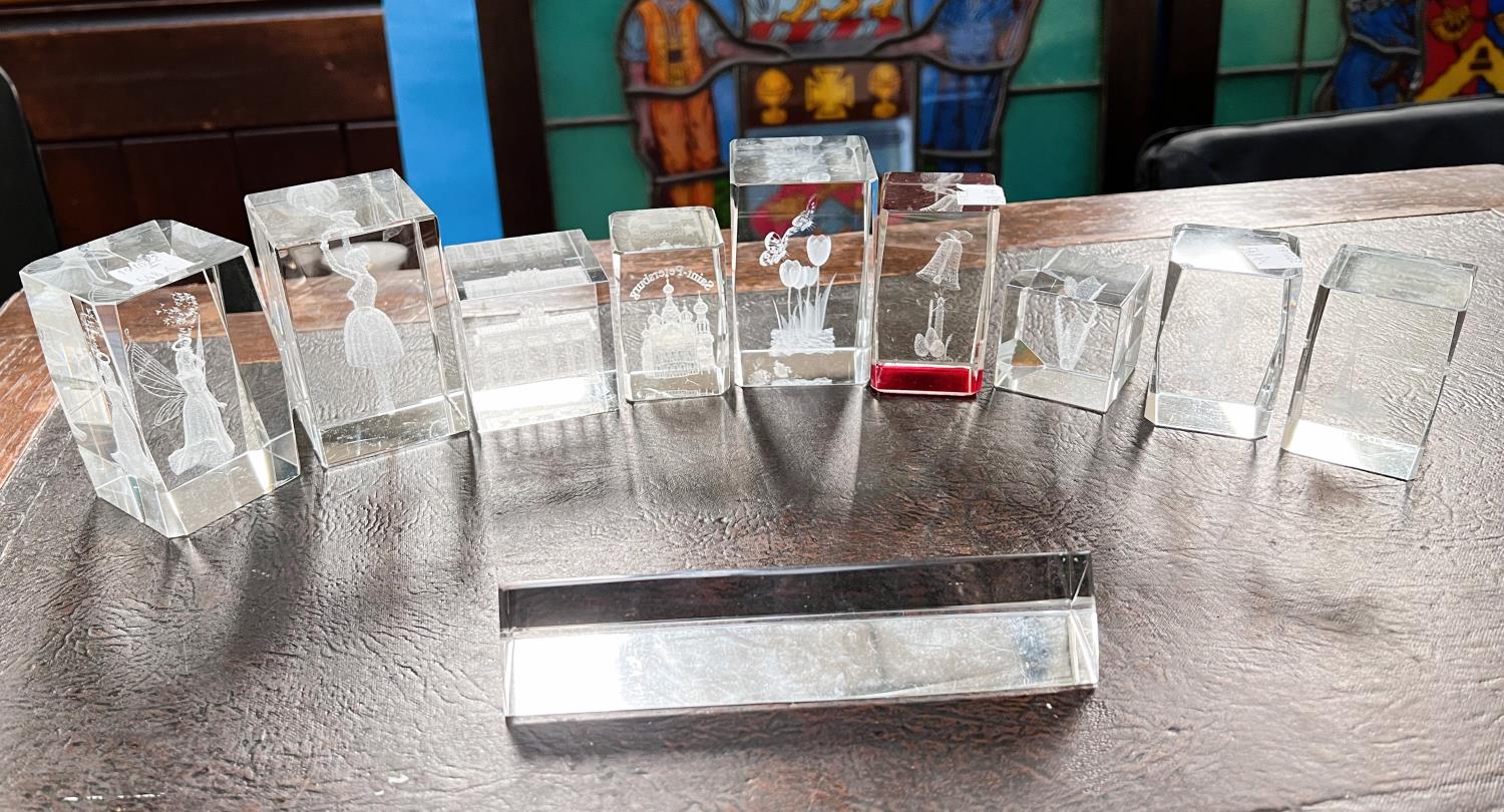A good selection of squared glass paperweights, various landmarks etc