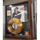 A Michael Jackson gold framed record for Bad, a selection of various world souvenirs, other