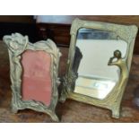 Two Art Nouveau free standing mirror, one brass and one plated