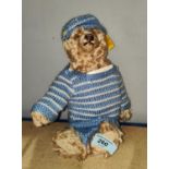 A modern Steiff Teddy Bear with blue striped jumper, button to ear