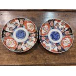 Two Japanese Imari pattern scalloped edge dishes and a selection of glassware
