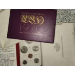 Two 1970's coinage sets in packs and a Singapore coin set