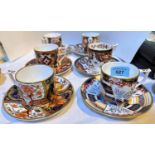 A set of 6 Royal Crown Derby coffee cups and saucers:  Tree of Life; Derby Old Japan; Pardoe;