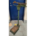 A set of early/mid century medical weighing scales in green with Royal Crown decoration, H Feredey &