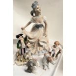 A late Meissen figure: man in 18th century dress with bagpipes and sheep, crossed swords mark; a