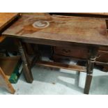 An oak trestle occasional table, a book rack and a stool