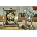 A 1950's gilt metal striking mantle clock by Shatz + a 400 day clock