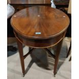 An Edwardian oval mahogany   table on square tapered legs and castors
