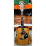 A vintage acoustic Yamaha steel strung guitar FG-400A; A vintage tan coloured leather travel