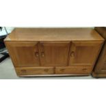 An Ercol pale elm sideboard fitted 2 drawers and 3 cupboards, 130 x 45, x75cm
