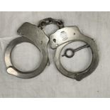 A pair of Smith & Wesson handcuffs.