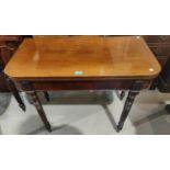 A 19th century rounded rectangular mahogany (near matching pair of) fold over tea tables on turned