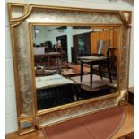 A large rectangular wall mirror in silvered/gilded frame, length 117cm