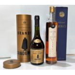 A 70cl bottle of LHERAUD CUVEE 10 Lot No 0741, boxed; a bottle of Sandeman Imperial brandy in tin