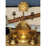 A 19th century Asthetic movement brass mantel clock with twin candelabra to each side, small