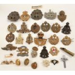 A selection of military badges, buttons etc